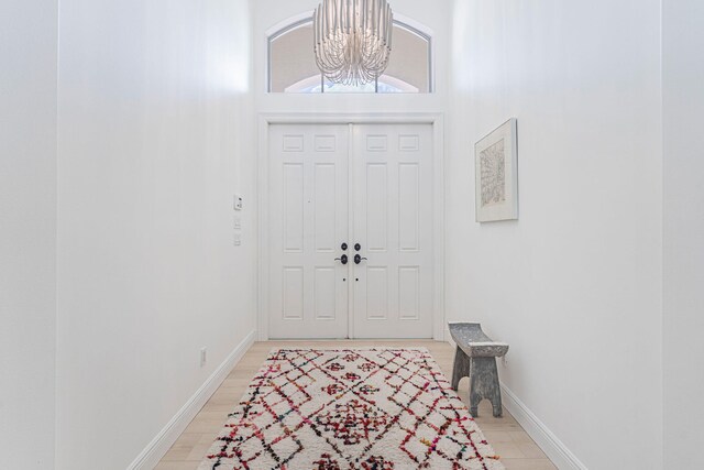 2068 Wightman Dr, Wellington, FL 33414 - entryway featuring a chandelier, baseboards, and a high ceiling