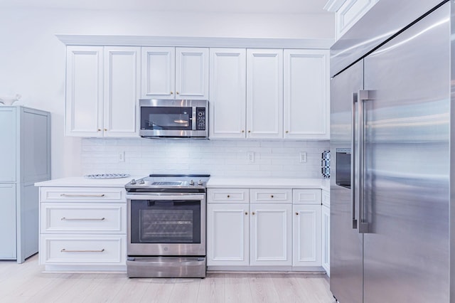 2068 Wightman Dr, Wellington, FL 33414 - kitchen featuring appliances with stainless steel finishes, light countertops, and decorative backsplash