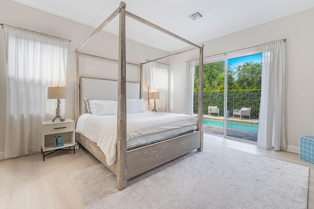 2068 Wightman Dr, Wellington, FL 33414 - bedroom featuring access to exterior and wood finished floors