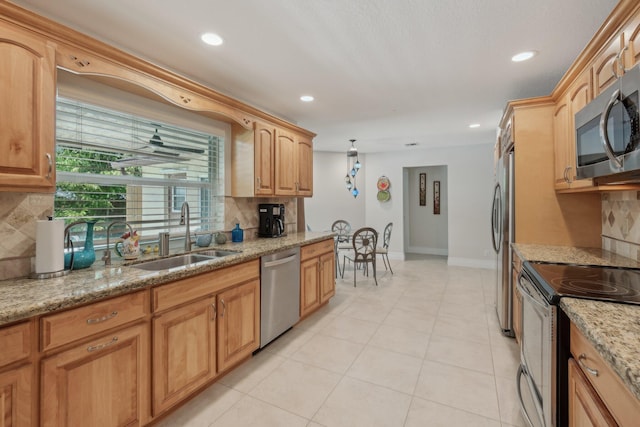 6085 Elmwood Dr, Boca Raton, FL 33433 - kitchen with stainless steel appliances, a sink, tasteful backsplash, baseboards, and recessed lighting
