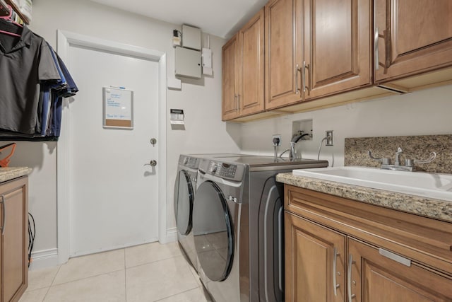 6085 Elmwood Dr, Boca Raton, FL 33433 - laundry area with washer and dryer, cabinet space, light tile patterned floors, and baseboards