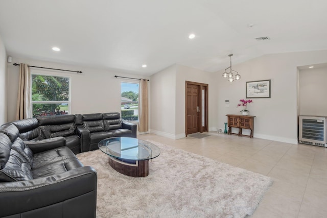 6085 Elmwood Dr, Boca Raton, FL 33433 - living room featuring light tile patterned floors, vaulted ceiling, a chandelier, heating unit, and baseboards