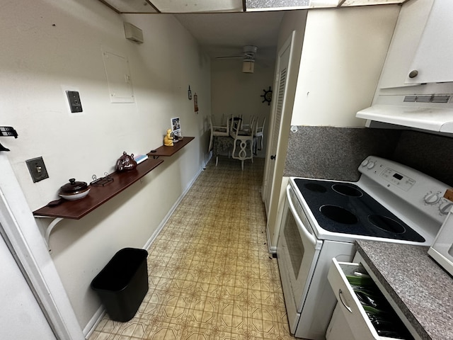 659 W Oakland Park Blvd Unit 206C, Oakland Park, FL 33311 - kitchen featuring white electric stove, light flooring, under cabinet range hood, baseboards, and ceiling fan
