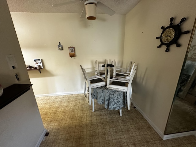 659 W Oakland Park Blvd Unit 206C, Oakland Park, FL 33311 - dining area with a textured ceiling, baseboards, tile patterned floors, and ceiling fan
