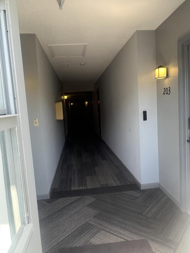 659 W Oakland Park Blvd Unit 206C, Oakland Park, FL 33311 - hallway with attic access and carpet