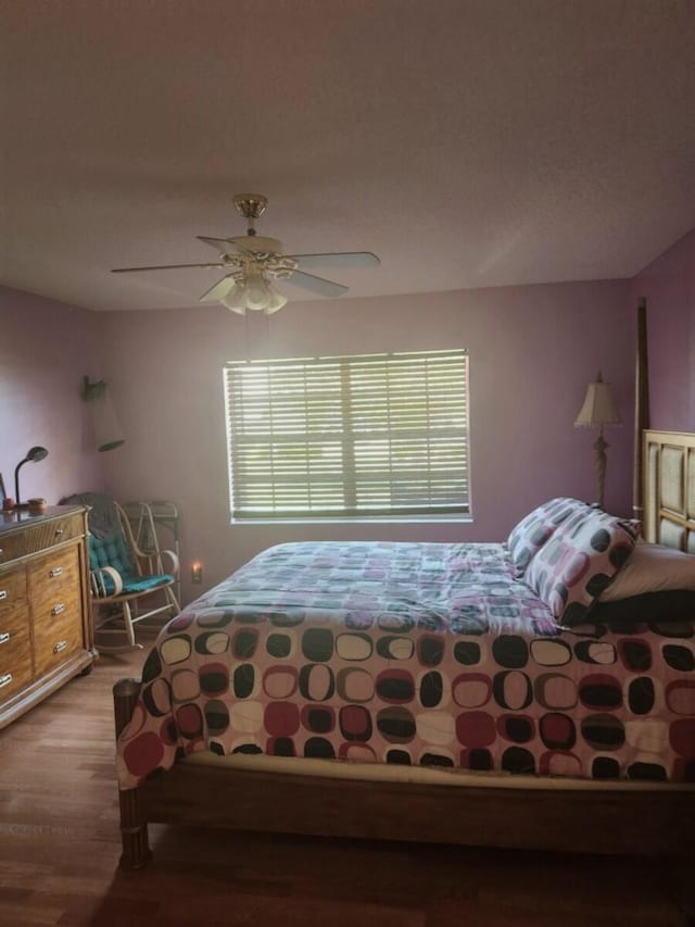 5794 Moss Ct Unit 7, Fort Pierce, FL 34982 - bedroom with wood finished floors and a ceiling fan