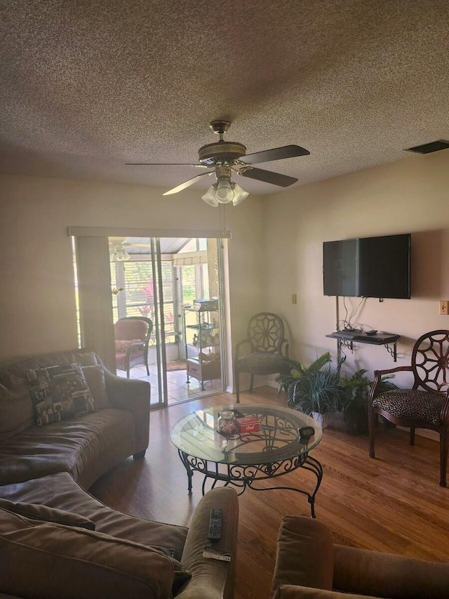 5794 Moss Ct Unit 7, Fort Pierce, FL 34982 - living area with a ceiling fan, wood finished floors, and a textured ceiling