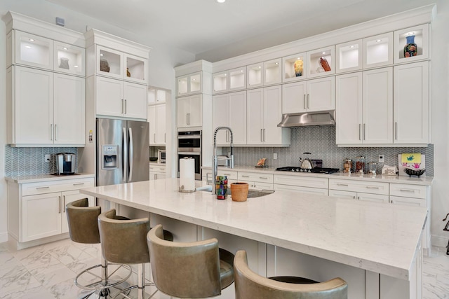 kitchen with stainless steel appliances, light marble finish floors, and white cabinets