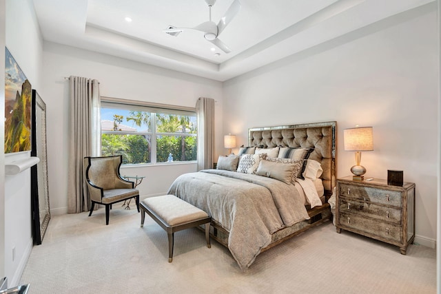 bedroom featuring light colored carpet, baseboards, ceiling fan, recessed lighting, and a raised ceiling