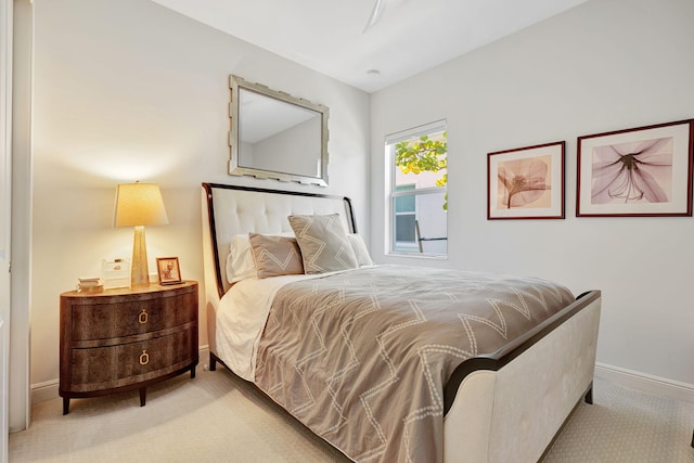 bedroom featuring carpet floors and baseboards