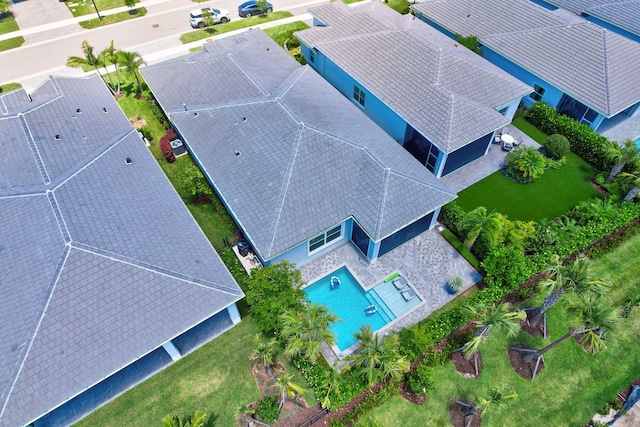 view of subject property with a pool