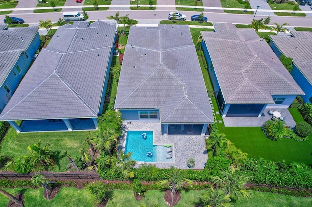 aerial view of property and surrounding area with a pool