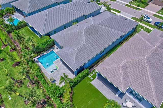 view of subject property with a pool area