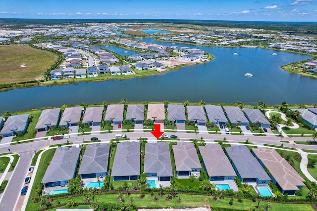 view of property location with nearby suburban area and a nearby body of water
