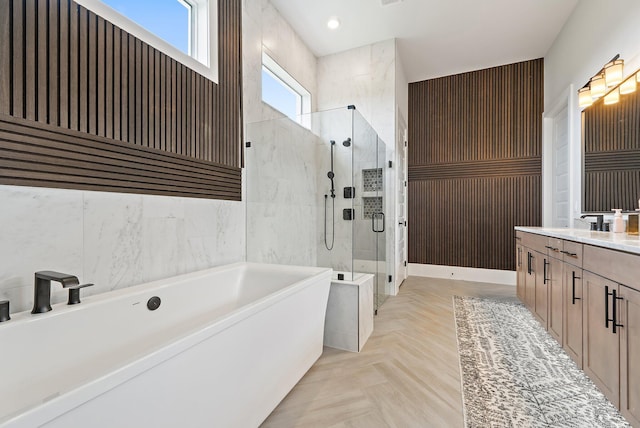 20049 SE Bridgewater Dr, Jupiter, FL 33458 - bathroom featuring a stall shower, a bath, vanity, and tile walls
