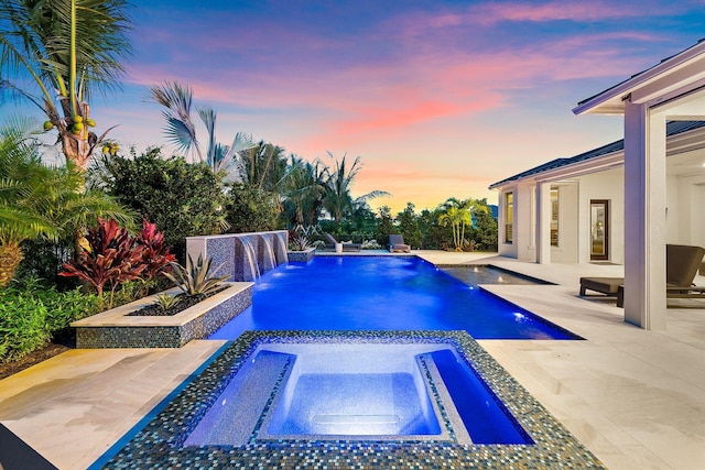 20049 SE Bridgewater Dr, Jupiter, FL 33458 - pool at dusk with a patio and a pool with connected hot tub