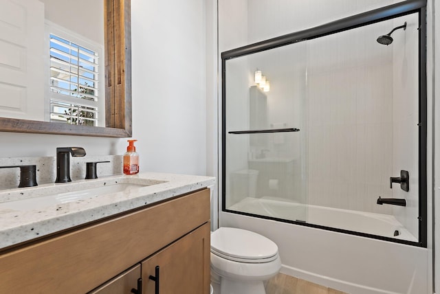 20049 SE Bridgewater Dr, Jupiter, FL 33458 - bathroom with vanity, toilet, and enclosed tub / shower combo