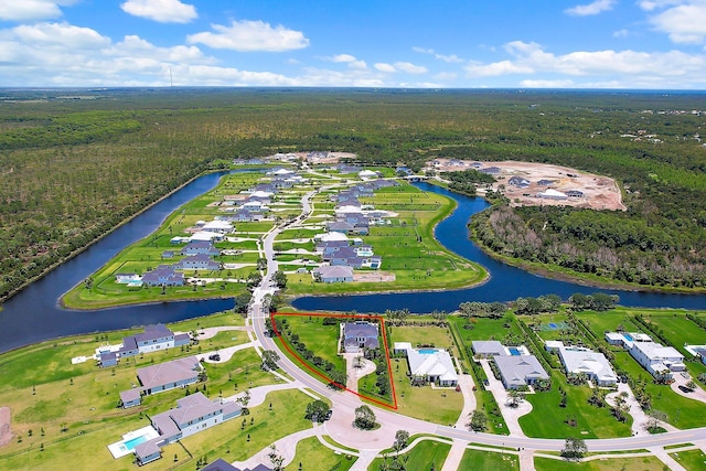 20049 SE Bridgewater Dr, Jupiter, FL 33458 - aerial perspective of suburban area featuring a heavily wooded area and a nearby body of water