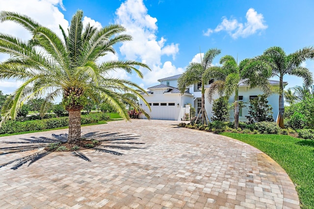 20049 SE Bridgewater Dr, Jupiter, FL 33458 - view of front of home with curved driveway and an attached garage