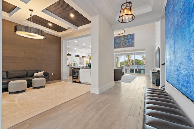 20049 SE Bridgewater Dr, Jupiter, FL 33458 - building lobby featuring recessed lighting, a towering ceiling, coffered ceiling, and wood walls