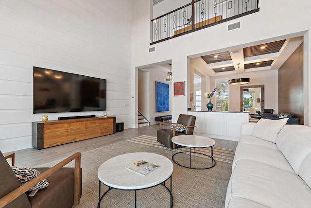 20049 SE Bridgewater Dr, Jupiter, FL 33458 - living room with wood finished floors, stairway, a high ceiling, coffered ceiling, and beam ceiling