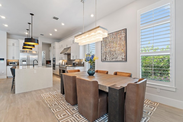 20049 SE Bridgewater Dr, Jupiter, FL 33458 - dining room featuring recessed lighting, light wood-style flooring, and baseboards