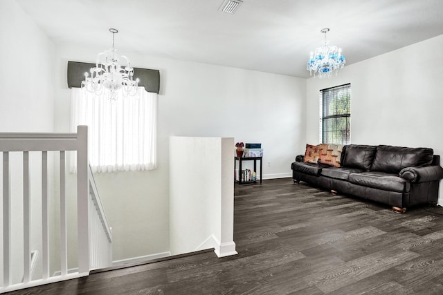living area with a chandelier, dark wood-style flooring, and baseboards