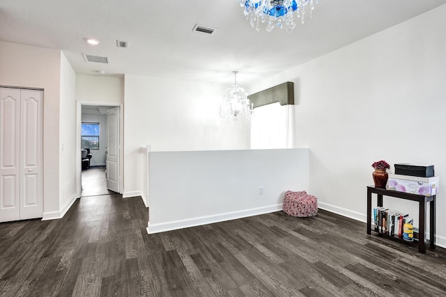 unfurnished dining area with a chandelier, dark wood-style flooring, baseboards, and recessed lighting