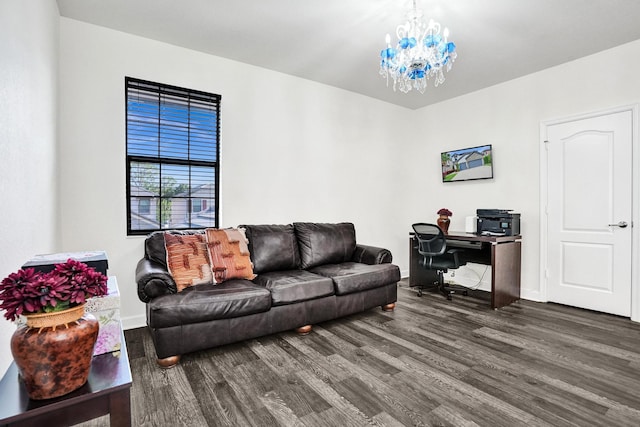 living area featuring wood finished floors, an office area, a chandelier, and baseboards