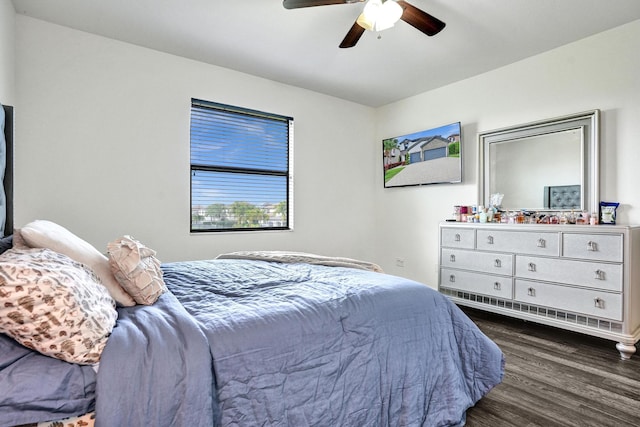 bedroom with wood finished floors and a ceiling fan