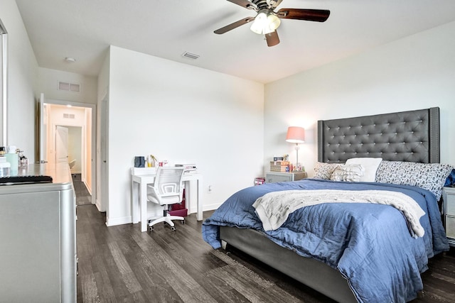 bedroom featuring wood finished floors, baseboards, and a ceiling fan