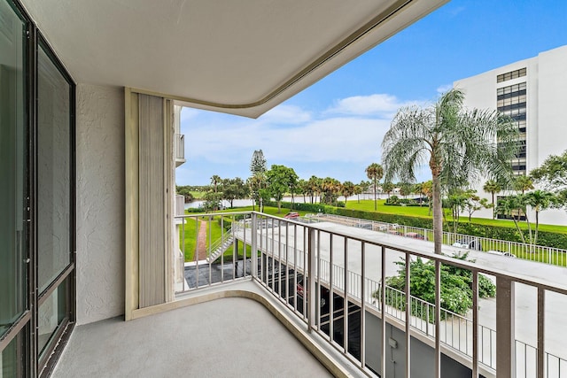 balcony featuring a water view