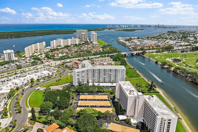 view of urban area featuring a nearby body of water and a notable bridge