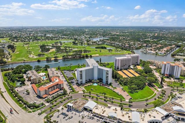 aerial view of a large body of water and apartment complex / building