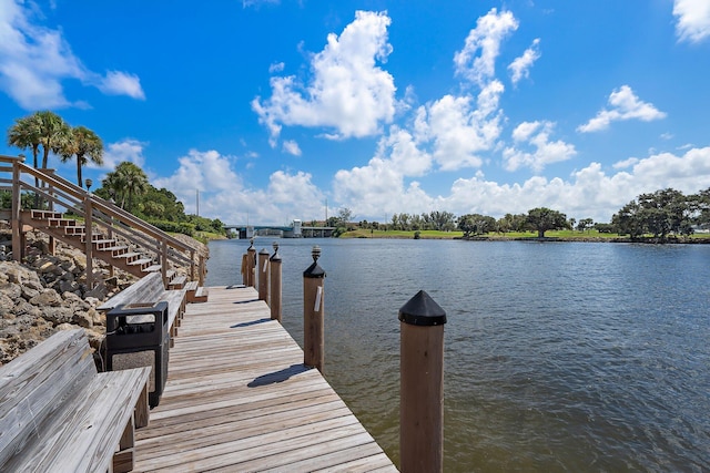 dock featuring a water view and stairs