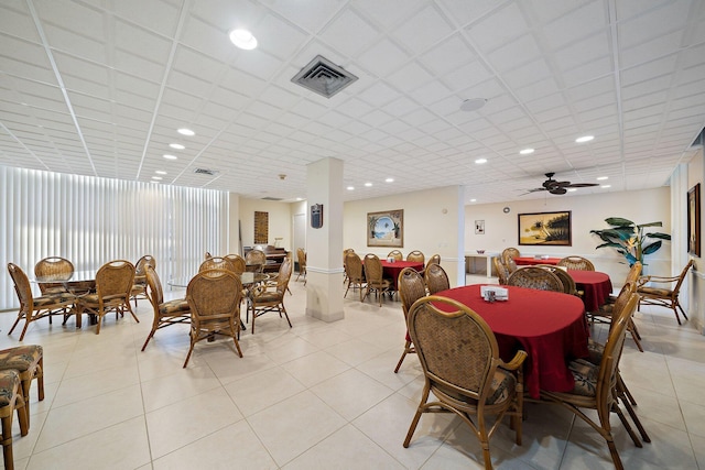 dining space featuring light tile patterned floors, a paneled ceiling, and recessed lighting