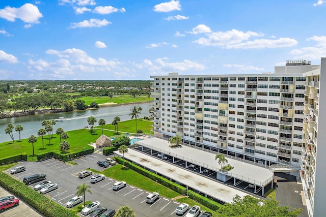 aerial view of a nearby body of water and apartment complex / building