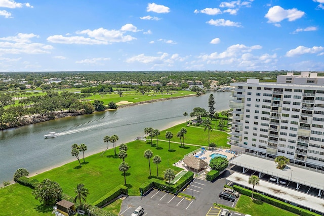 bird's eye view of a large body of water and apartment complex / building