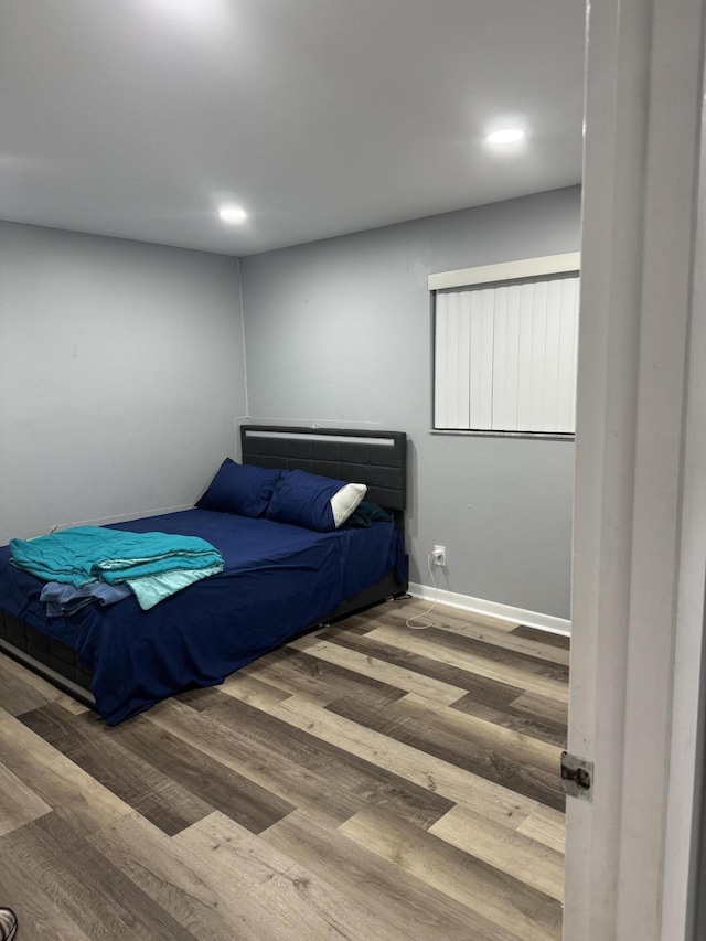 4155 NW 90th Ave Unit 106, Coral Springs, FL 33065 - bedroom with wood finished floors and recessed lighting