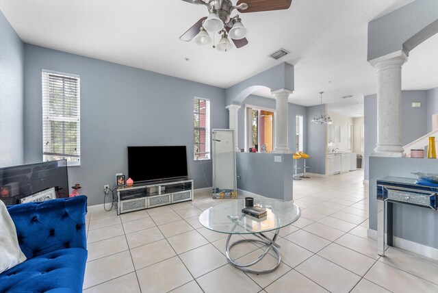 3518 Shoma Dr, Royal Palm Beach, FL 33414 - living room with ornate columns, a ceiling fan, light tile patterned floors, and baseboards