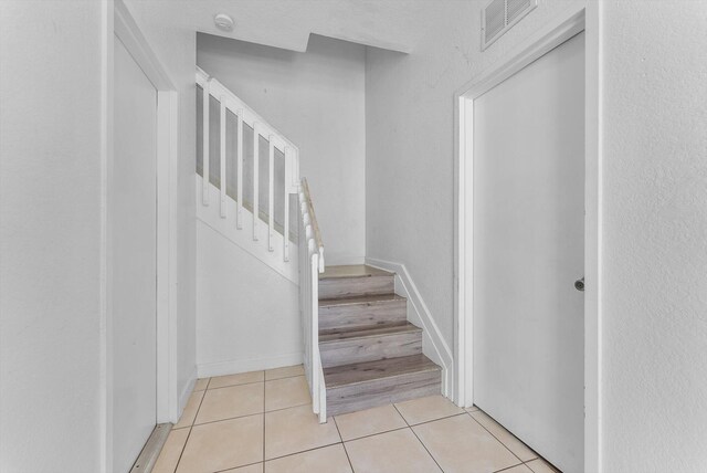3518 Shoma Dr, Royal Palm Beach, FL 33414 - stairs with tile patterned floors