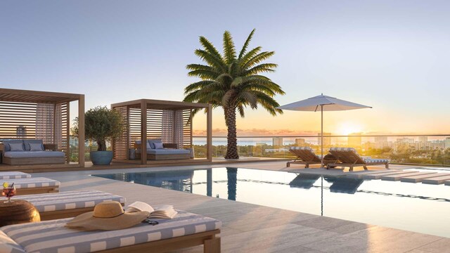 280 E Palmetto Park Rd Unit 82, Boca Raton, FL 33432 - pool at dusk featuring an outdoor pool