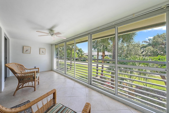 sunroom with plenty of natural light and tile patterned flooring