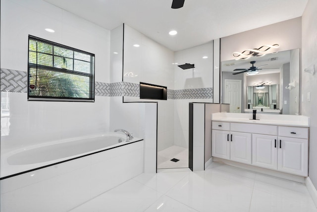 632 SW Mccall Rd, Port Saint Lucie, FL 34953 - full bathroom featuring a ceiling fan, a garden tub, walk in shower, vanity, and tile patterned floors
