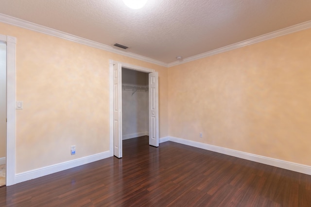 2853 SE Melaleuca Blvd, Port Saint Lucie, FL 34952 - unfurnished bedroom featuring dark wood-style floors, ornamental molding, a closet, and a textured ceiling