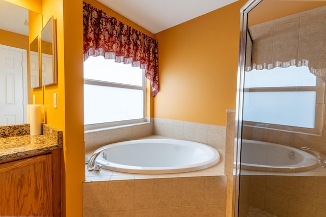 2853 SE Melaleuca Blvd, Port Saint Lucie, FL 34952 - full bath with vanity, a bath, and a shower stall