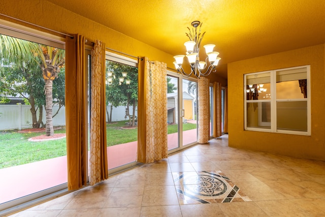 2853 SE Melaleuca Blvd, Port Saint Lucie, FL 34952 - unfurnished dining area featuring a chandelier and tile patterned floors