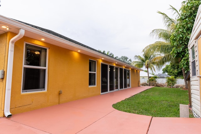 2853 SE Melaleuca Blvd, Port Saint Lucie, FL 34952 - back of property with stucco siding and a patio area