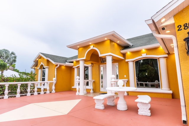 2853 SE Melaleuca Blvd, Port Saint Lucie, FL 34952 - view of front facade with a shingled roof and stucco siding
