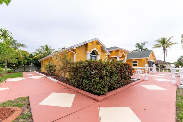 2853 SE Melaleuca Blvd, Port Saint Lucie, FL 34952 - view of side of home featuring stucco siding